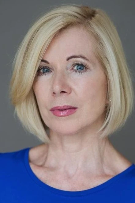 headshot of Joan Fleetwood in a blue top